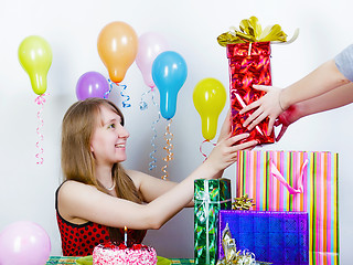 Image showing Birthday. The girl accepts gifts