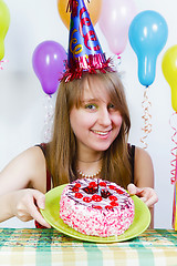 Image showing Birthday. A young attractive girl with cake