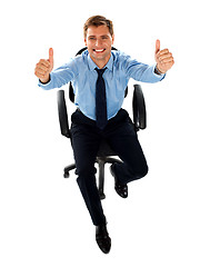 Image showing Male executive showing double thumbs up