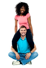 Image showing Girlfriend riding on her mans shoulder