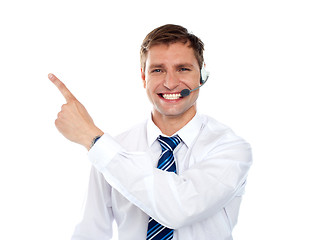 Image showing Customer service agent pointing away