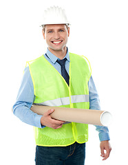Image showing Young architect holding construction map