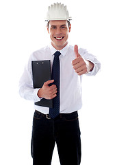 Image showing Cheerful architect gesturing thumbs up