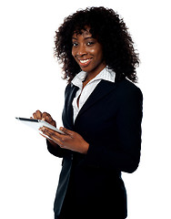 Image showing Cheerful business woman using tablet pc