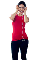 Image showing Trendy girl teenager tuned into music