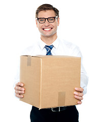 Image showing Businessman holding packed carton