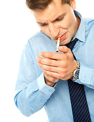 Image showing Handsome businessman with a cigarette