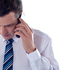 Image showing Cropped image of man talking on cell phone
