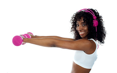 Image showing Teenager listening to music and exercising