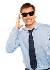 Image showing Guy wearing sunglasses and listening to music