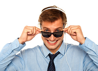 Image showing Musical guy peeping from sunglasses