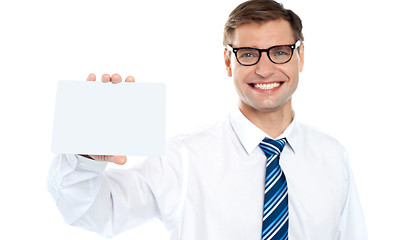 Image showing Handsome male showing blank business card