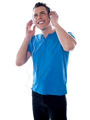 Image showing Attractive caucasian male listening music