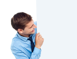 Image showing Male executive holding blank whiteboard