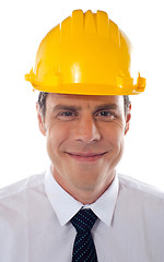 Image showing An architect wearing yellow safety helmet