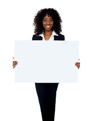 Image showing African woman showing billboard banner