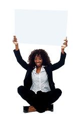 Image showing Female executive with whiteboard over her head