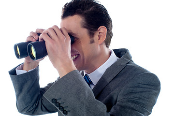 Image showing Male executive using binoculars