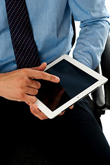 Image showing Closeup shot of man operating tablet pc