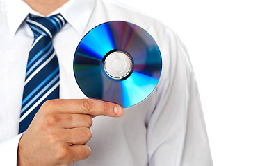 Image showing Closeup of a man holding compact disc