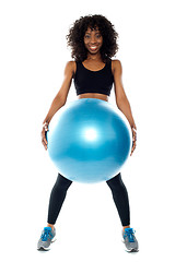 Image showing Sporty woman holding pilate ball