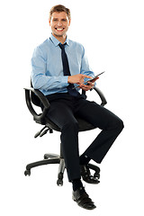 Image showing Corporate man working on touch pad device