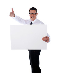 Image showing Thumbs up businessman holding banner ad