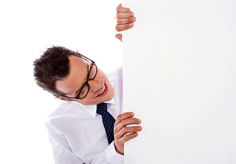 Image showing Executive peeping from behind empty signboard