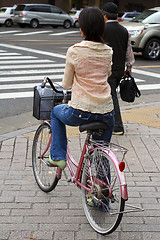 Image showing Japanese woman riding bicycle