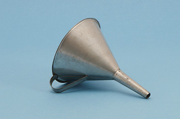 Image showing Ancient metal aluminum funnel on blue background 