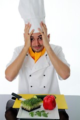 Image showing Bewildered chef with ingredients