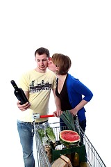 Image showing Couple with shopping chart _ kissing