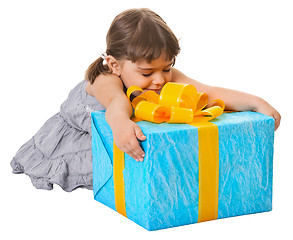 Image showing Happy child embraces large birthday gift