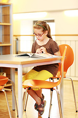 Image showing School girl studying in library