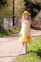 Image showing little girl in dandelion wreath