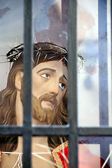 Image showing Jesus Christ head statue behind bars