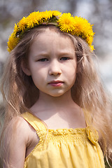 Image showing little girl in dandelion wreath