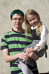 Image showing little sister on brother's hands