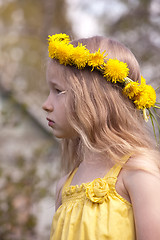 Image showing profile portrait of little girl in dandelion wreath