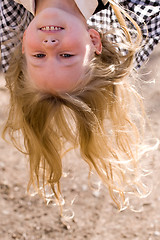 Image showing head over heels face of little girl