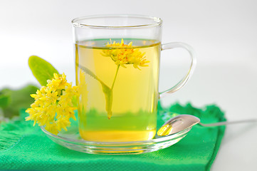 Image showing cup of linden tea and flowers 