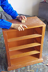 Image showing craftsman grinding