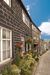 Image showing Old Mill Cottages and Flowers