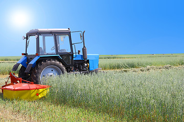 Image showing Tractor in a field, agricultural scene in summer