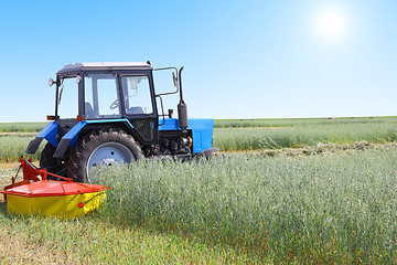 Image showing Tractor in a field, agricultural scene in summer