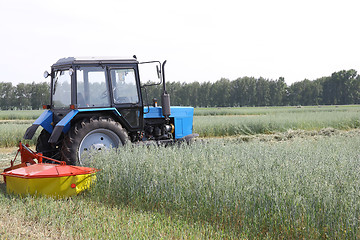 Image showing Tractor in a field, agricultural scene in summer