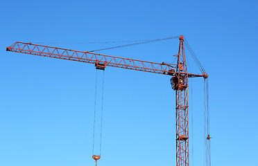 Image showing red crane and blue sky on building site