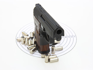 Image showing The pistol with the brown handle 