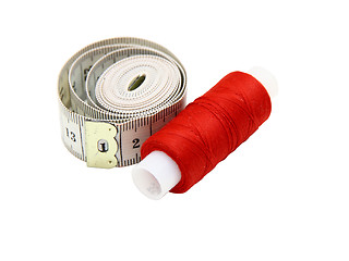 Image showing The coil of a red thread with centimeter 