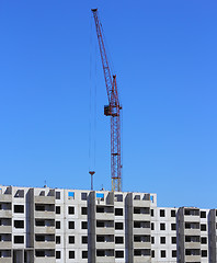 Image showing red crane and blue sky on building site